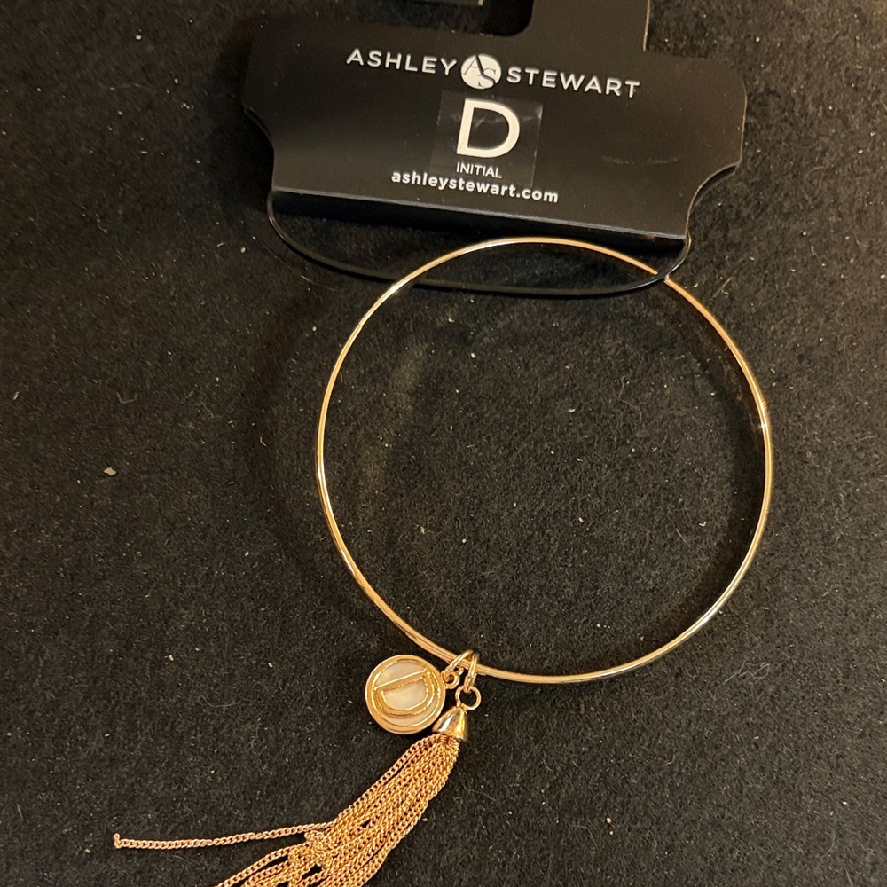 Ashley Stewart Gold Bracelet with Tassel and Charm